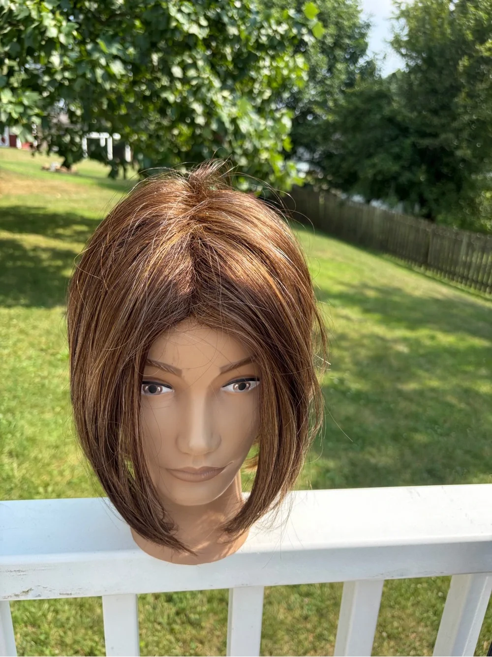 Bobbi Boss Midway brown with honey highlights angled straight Bob synthetic wig